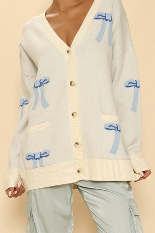 All over bow knit cardigan *Online Only* - Premium  at Lonnys NY - Just $64.68! Shop Womens clothing now