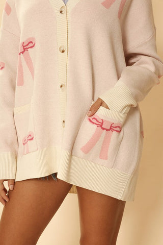 All over bow knit cardigan *Online Only* - Premium  at Lonnys NY - Just $64.68! Shop Womens clothing now